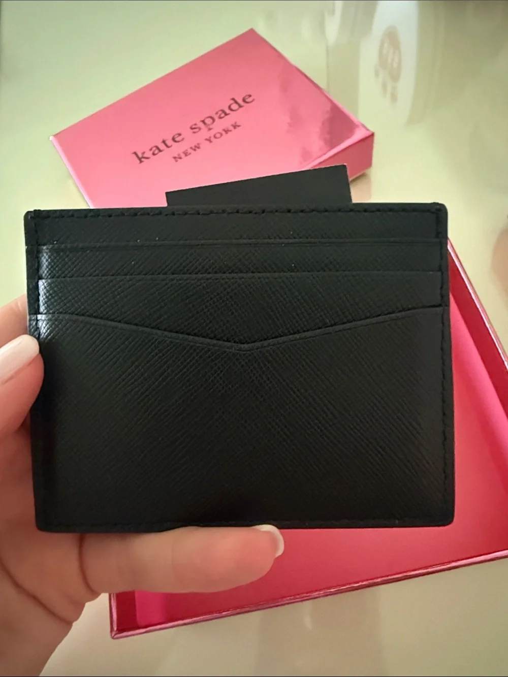 Kate Spade black Saffiano leather card holder with gold logo